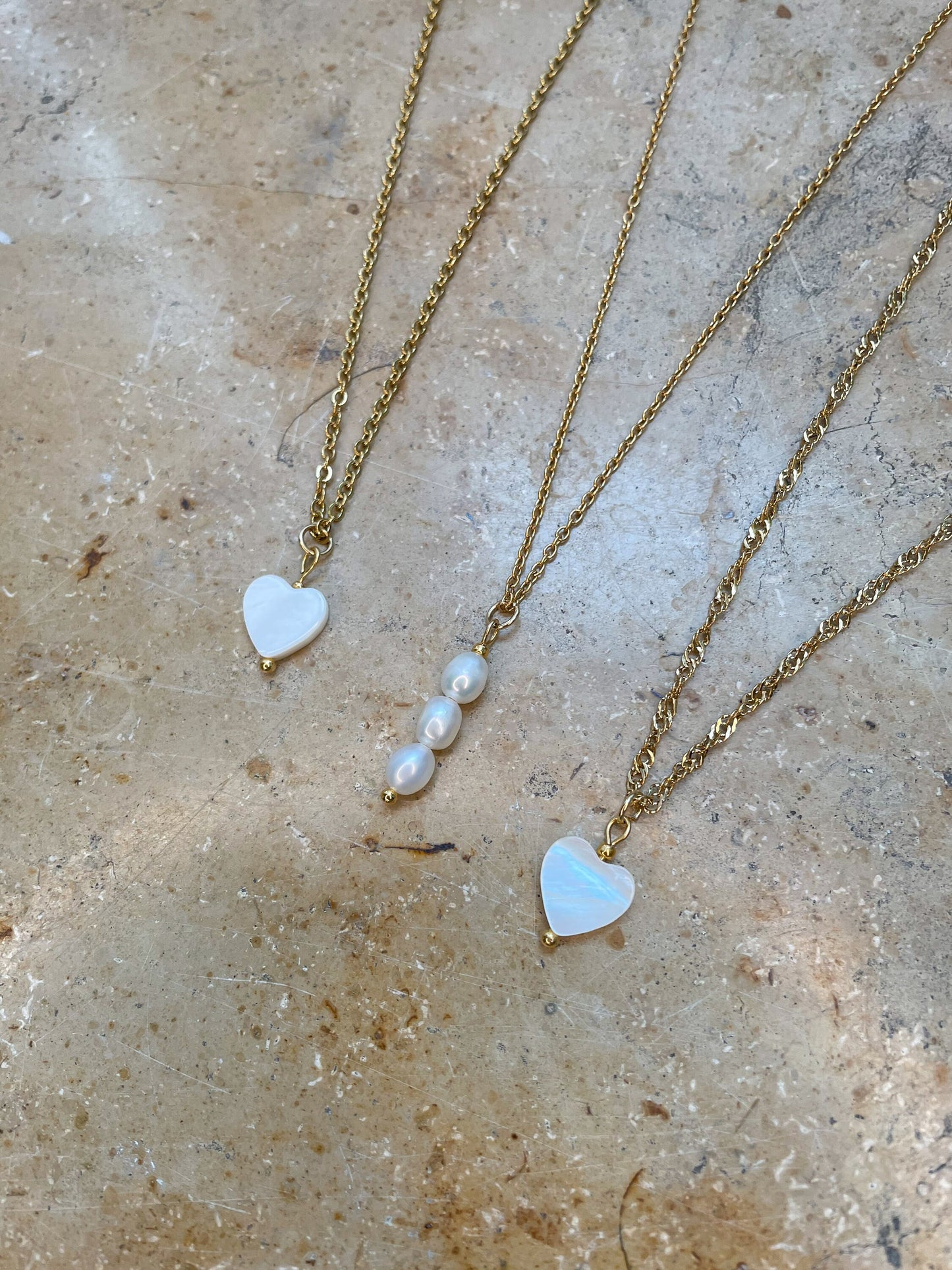 gold chain with heart pendant